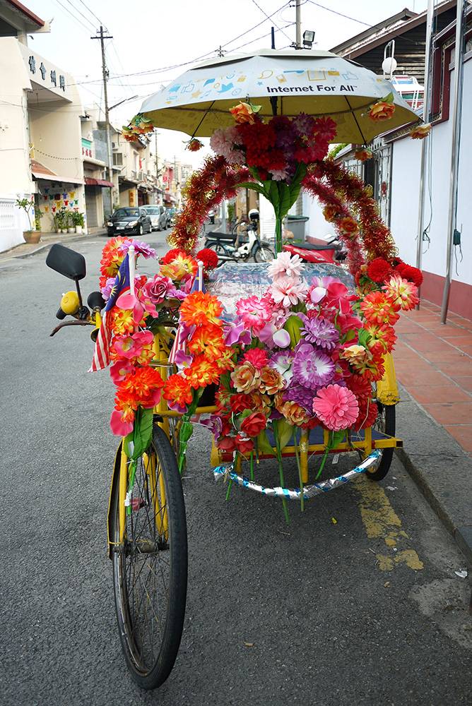 Trishaw decorated with flowers Trishaw decorated with flowers