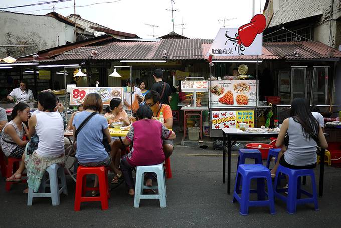 People eating at the market People eating at the market