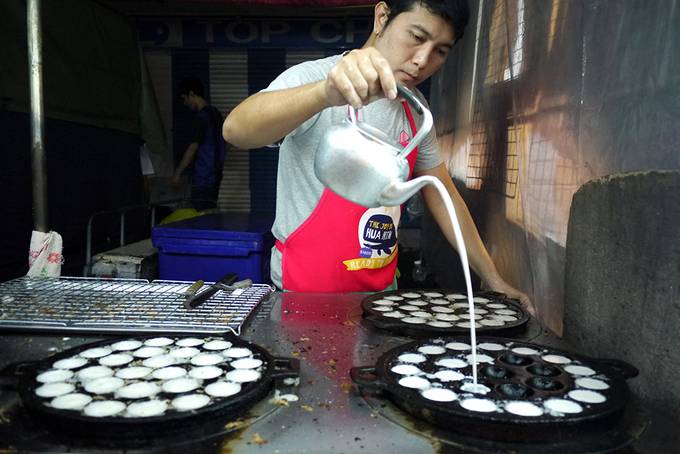 man making coconut pancakes man making coconut pancakes